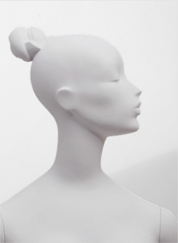 Female mannequin head with bun