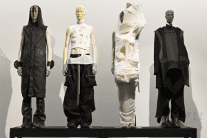 Four mannequins dressed in black and white clothing